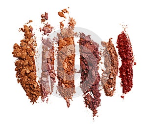 Smashed dark eyeshadows isolated on white background
