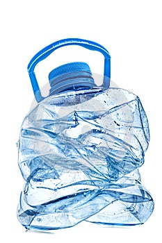 Smashed empty plastic bottle with blue cap, isolated on white background