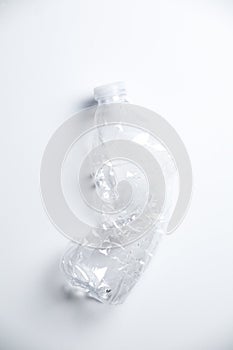 Smashed Empty Plastic Water Bottle on White Background