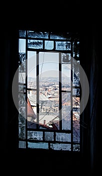 A smashed smoked window of an old house at the center of Tbilisi