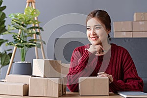 SME business entrepreneurs small in asia Preparing cardboard boxes in home office Small business operators preparing to