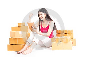 SME e-commerce shopping online concept. Attractive beautiful young asian woman startup small business entrepreneur using computer