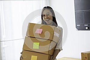 SME entrepreneur of Young Asian women working with laptop for Online shopping at home,Cheerful and Happy with box