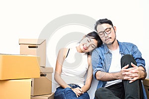 SME or freelance asian woman and man working with box