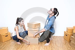 SME or freelance asian woman and man working with box