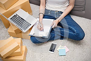 SME or freelance asian woman working with box