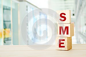 SME , Small and Medium Enterprise , business word on wooden cube