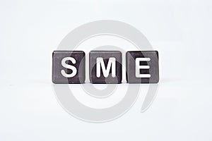 SME (or small and medium enterprises) on cubes on a white background