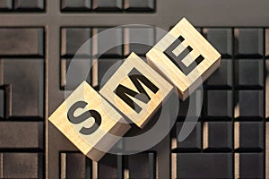 Sme - Small and medium enterprises - letter pices on the wooden blocks