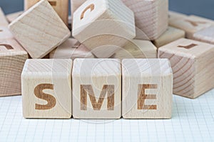 SME, small and medium-sized enterprises concept, cube wooden block with alphabet combine the word SME, entrepreneur business