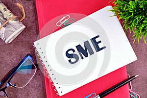 The SME symbol in a notebook on a blank sheet in a