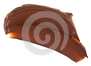Smear of chocolate spread isolated on a white background, top view. Chocolate hazelnut cream.