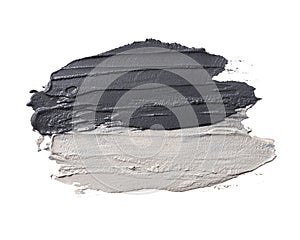 Smear of cosmetic black and blue clay isolated on a white background
