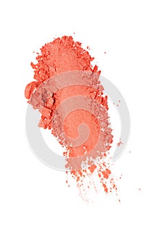 Smear of crushed orange eyeshadow as sample of cosmetic product
