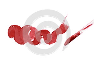 Smear liquid red lipstick and brush isolated on a white background