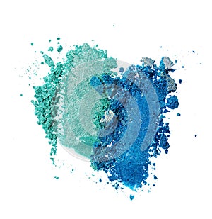 Smears of crushed teal and blue shiny eyeshadow as sample of cosmetic product