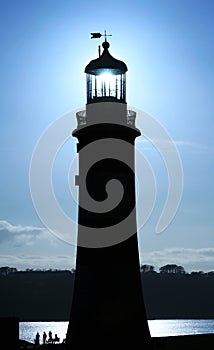 Smeaton`s Tower with group of people enjoying the sunshine, Plym