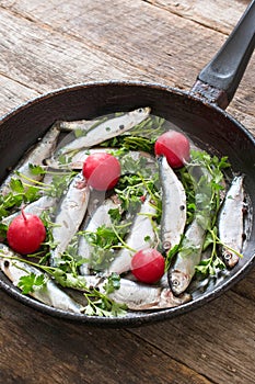 Smelt fishes in old pan