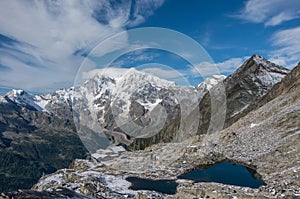 Smeraldo lake and funicular station with Rosa Mount on the background. View from Monte Moro pass near Macugnaga, Italy photo