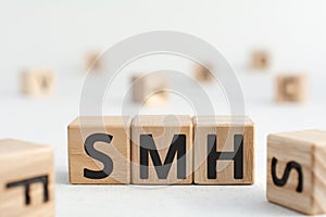 smh - acronym from wooden blocks with letters