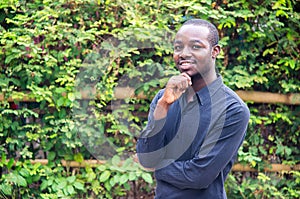 Smile african business man in green nature background