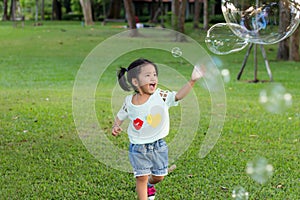 Smile asian baby girl play bubble balloon