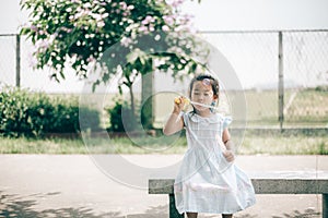 Smile asian baby girl play bubble balloon