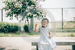 Smile asian baby girl play bubble balloon