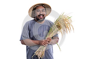 Smile asian farmer holding paddy rice grain isolated on white