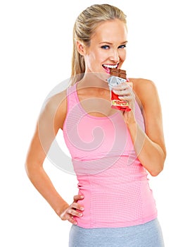 Smile, athlete or portrait of woman with chocolate, snack or cheat meal on diet in studio on white background. Candy