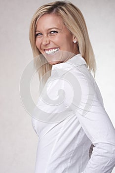 Smile beautiful blond girl in white chemise photo