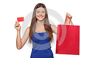 Smile beautiful happy woman holding shopping bag and showing blank credit card, sale, isolated on white background