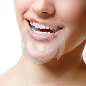 Smile of beautiful woman with great healthy white teeth.
