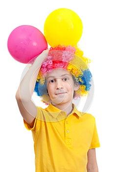 Smile boy in clown wig with two air balloons