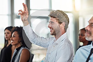 Smile, business man and hands raised for questions at conference, seminar or meeting. Male person, happy and hand up for