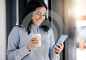 Smile, businesswoman with phone and coffee on break browsing social media and internet or typing message. Technology