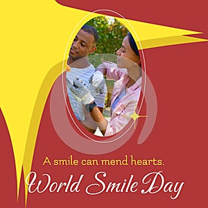A smile can mend hearts world smile day text and biracial couple smiling
