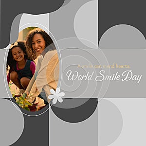 A smile can mend hearts world smile day text and biracial mother and daughter smiling