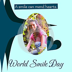 A smile can mend hearts world smile day text and biracial woman smiling over blue background