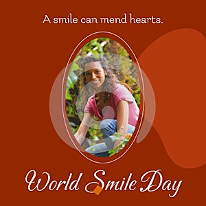 A smile can mend hearts world smile day text and biracial woman smiling over brown background
