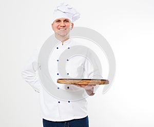 Smile chef in uniform hold empty cutting desk isolated on white background