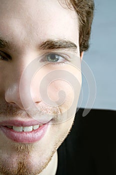 Smile closeup crop face young male portrait