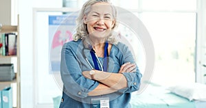 Smile, crossed and face of senior doctor with confidence in her medical consultation office at a clinic. Happy