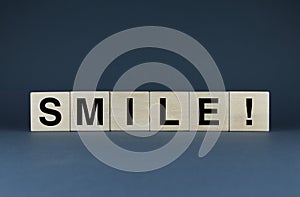 Smile. Cubes form the word Smile. The broad concept of the word smile