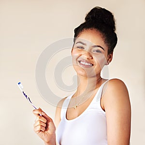 Smile, dental and portrait of woman with toothbrush in studio for morning hygiene routine for teeth. Happy, health and
