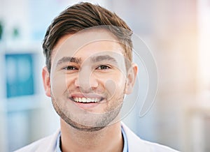 Smile, doctor face and portrait of man in hospital with for wellness, medicine and medical care. Healthcare, headshot
