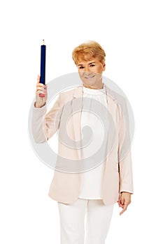 Smile elderly woman pointing up with hege pen