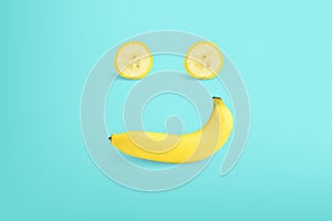 Smile face made of bananas on color background