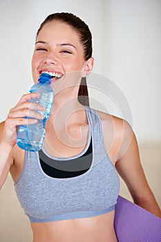 Smile, fitness and portrait of woman drinking water for pilates workout or exercise in gym. Happy, sports and thirsty