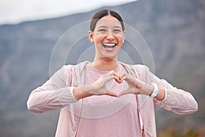 Smile, fitness and woman with heart hands for exercise in nature for race or marathon training. Happy, sports and